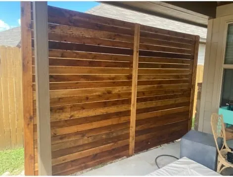 Dark stained horizontal cedar gate and fence